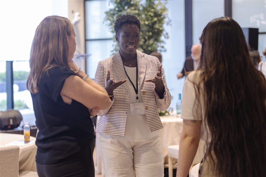 Dior Sarr in discussion with colleagues during a healthcare event.